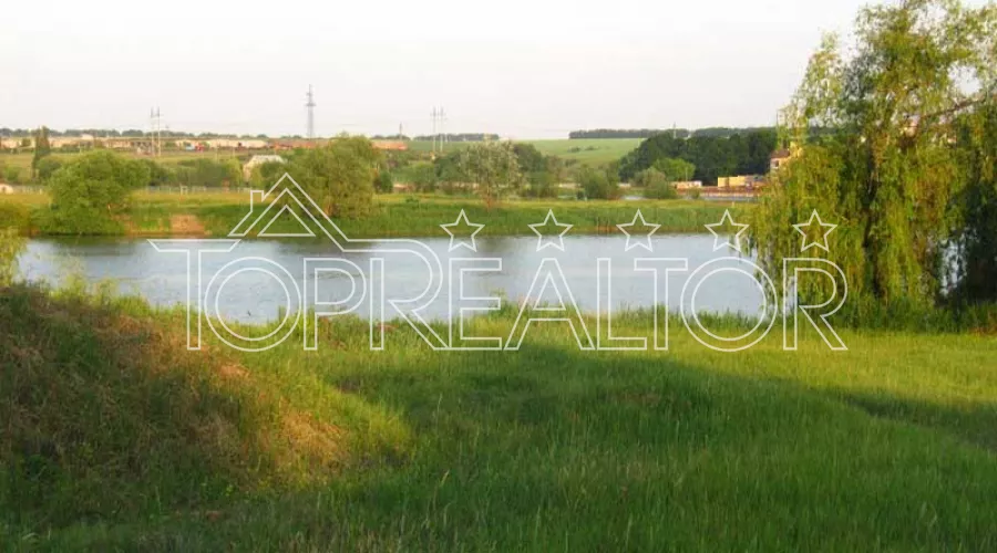 Ділянка 20 соток в Ольховці з виходом до води | Toprealtor